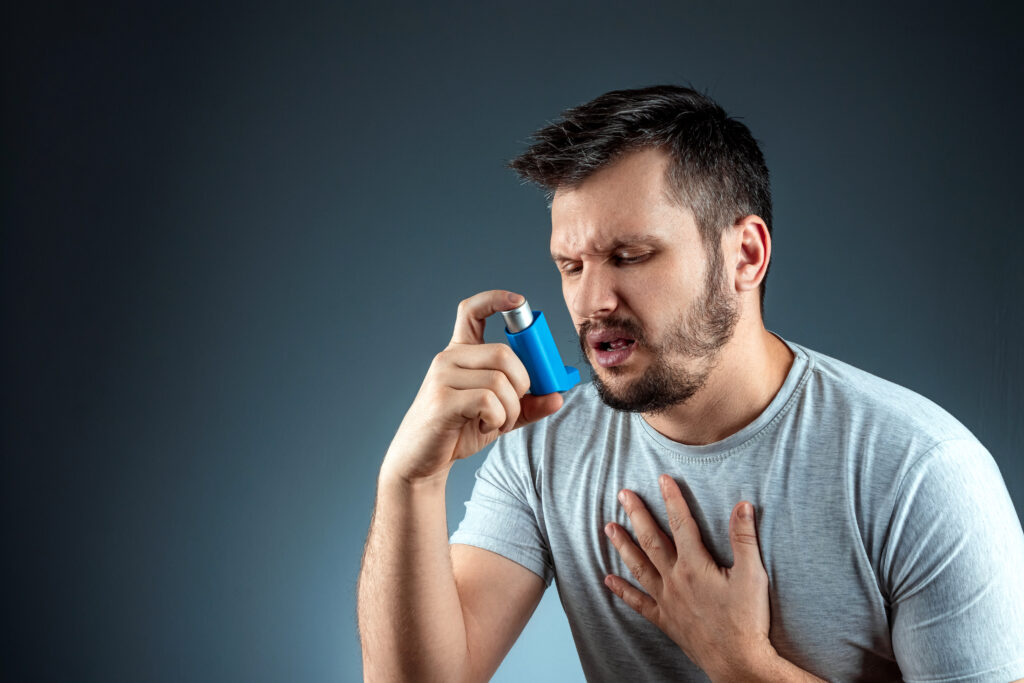 Man holding inhaler for asthma at Rashtrotthana Hospital Bangalore
